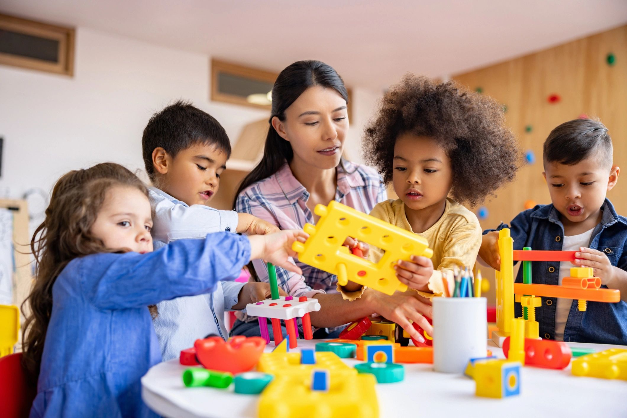 children playing with educational toy geometry shapes